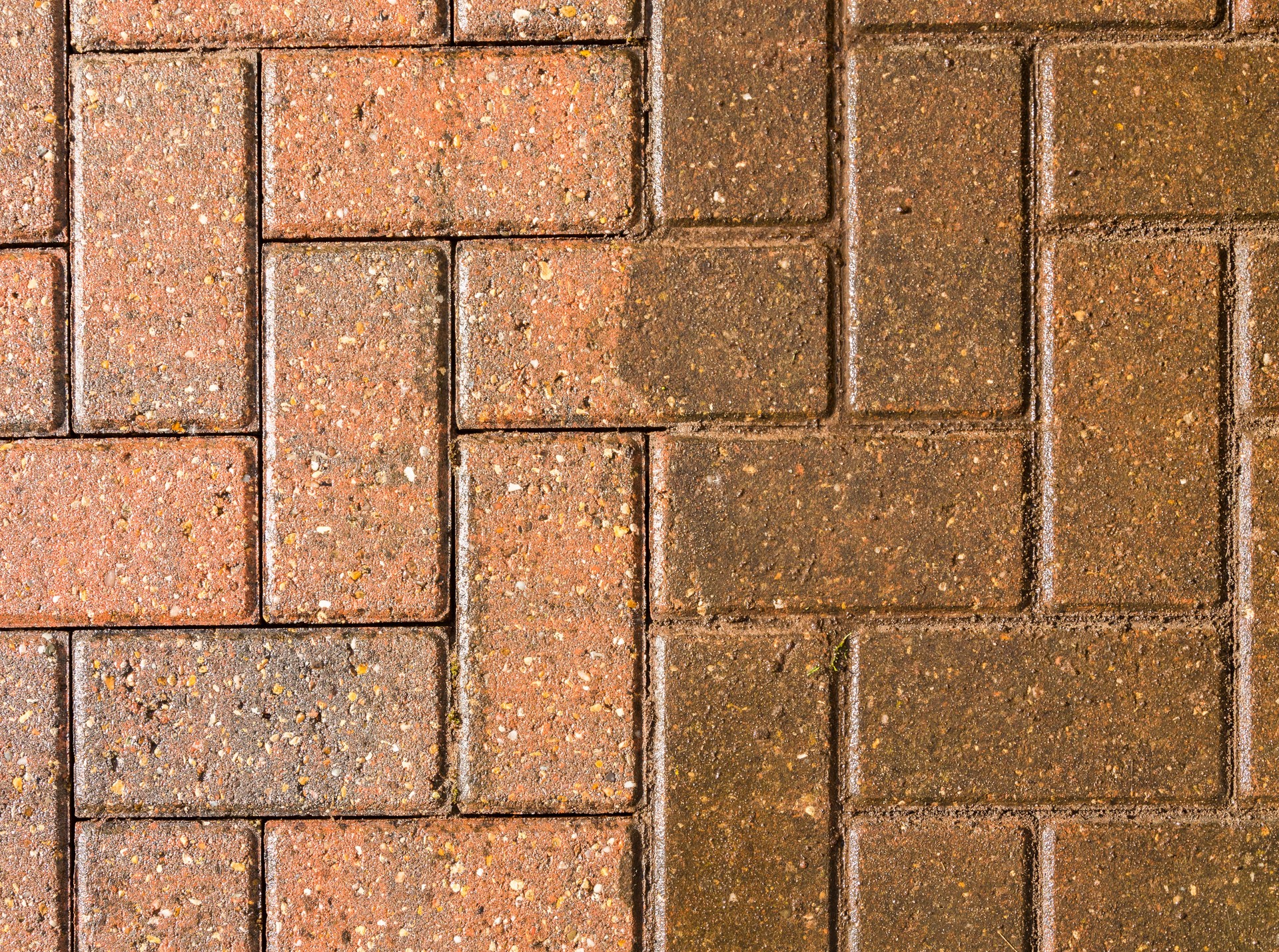 Block paving half jet washed and half still dirty